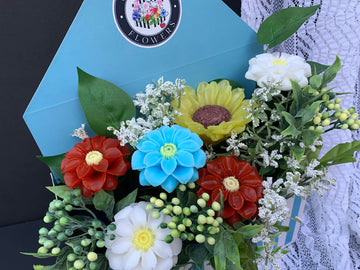 Little Dahlias and Sunflower enveloped flower arrangement